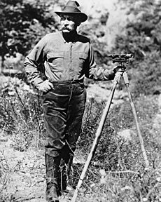 Portrait of William Mulholland with a surveyor's scope on a tripod, ca.1908-1913 (CHS-14459)