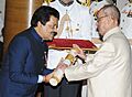 The President, Shri Pranab Mukherjee presenting the Padma Bhushan Award to Shri Udit Narayan Jha, at a Civil Investiture Ceremony, at Rashtrapati Bhavan, in New Delhi on April 12, 2016