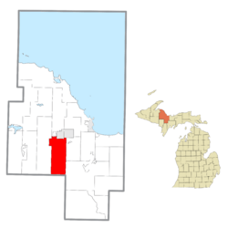 Location within Marquette County (red) and a small administered portion of the West Ishpeming community (pink)