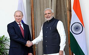 Vladimir Putin and Narendra Modi greet each other at the 15th Annual India-Russia Summit