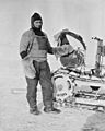 William Lashly standing by a Wolseley motor sleigh during the British Antarctic Expedition of 1911-1913, November 1911