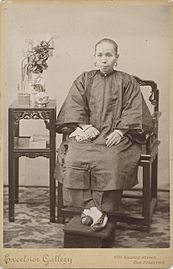 Woman of Asian descent sitting with bound feet - DPLA - e5beae56283e1bdbdc54a169d00e5674