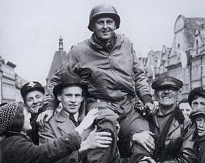 Col. Matt Konop hoisted by the people of Domazlice, May 1945
