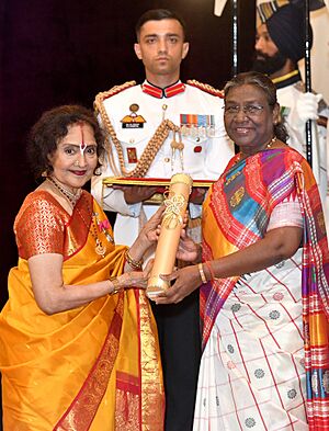 The President, Smt. Droupadi Murmu presenting the Padma Vibhushan Award to Dr. Vyjayantimala Bali