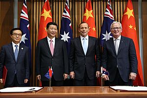 Abbott and Robb signing the Free Trade Agreement with Chinese President Xi and Minister for Commerce Gao Hucheng November 2014