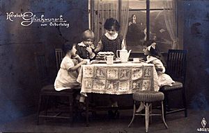 Girls with birthday cake. Postcard from 1920