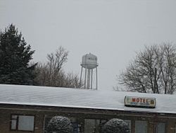 The Hillcrest water tower looms over a small business in the foreground