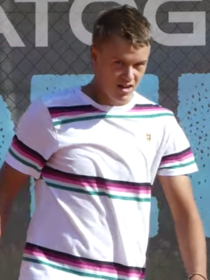 Holger Rune practicing 2019 (cropped)