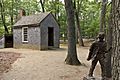 Replica of Thoreau's cabin near Walden Pond and his statue