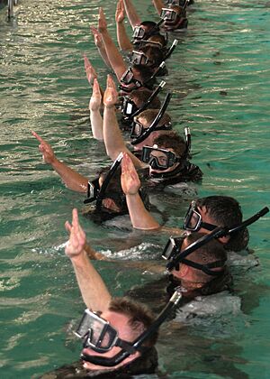 US Navy 050525-N-1577S-060 Search and Rescue (SAR) students give the I am all right signal to let the SAR instructors know that they are ready for further instructions