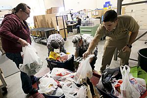 US Navy 111123-N-HW977-185 Sailors weigh Thanksgiving food drive donations before delivery to the Corona-Norco Settlement House