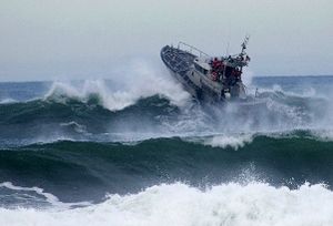 A motor lifeboat braving heavy waves off Tillamook Bay, Oregon