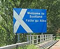 Bilingual border sign between England and Scotland