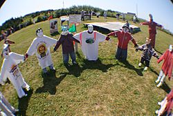 Circle of scarecrow children at Joe's Scarecrow Village.JPG