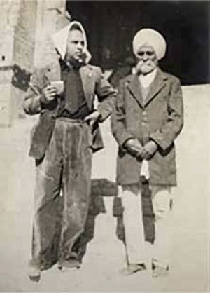 Photograph of Bhai Gian Singh Naqqash standing beside another individual