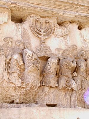 Carrying off the Menorah from the Temple in Jerusalem depicted on a frieze on the Arch of Titus in the Forum Romanum