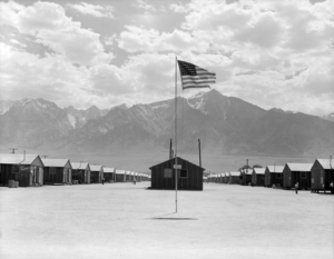 Manzanar Relocation Center, Manzanar, California. Street scene of barrack homes... - NARA - 538128 - restored