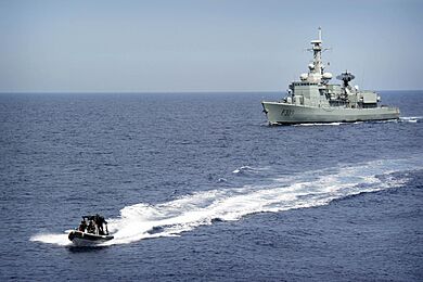 Portuguese navy VBSS team in a rigid-hull inflatable boat leaves the NRP Bartolomeu Dias