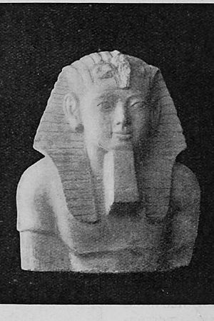 Upper half of statue of Hakor. In Cairo Museum