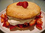 Strawberry shortcake on white plate, March 2009.jpg