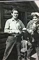 Two men with fiddle and bow - Kaska Dena - Lower Post BC 1945