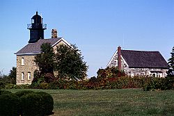 The Old Field Point Light, which, along with the adjacent Keeper's Cottage, serves as the village's Village Hall complex.