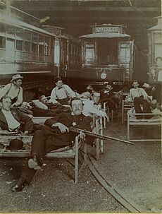 Posse members resting on cots in the United Railway car barn during the Streetcar Strike of 1900