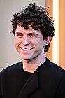 Picture of actor Tom Holland smiling at the premiere of The Odyssey in New York