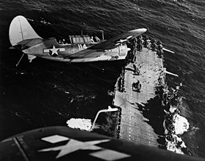 Two SBC2C-3 over USS Hornet (CV-12)