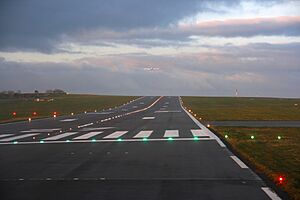 15 Bristol Airport sloped runway with runway lights in early morning - Bristol UK