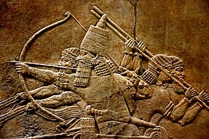 Ashurbanipal in a chariot, wall relief, 7th century BC, from Nineveh, the British Museum