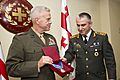 Commandant of the U.S. Marine Corps, Gen. James F. Amos receives an award at Tbilisi, Georgia, Sept. 4, 2014.