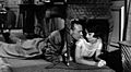 Screen capture of Gary Cooper and Audrey Hepburn lying on the floor