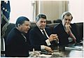 Photograph of President Reagan receiving the Tower Commission Report in the Cabinet Room - NARA - 198581