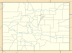 A map of Colorado showing county boundaries and rivers. There is a red dot in the center of Pitkin County in the central west region of the state.