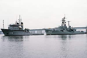 USS Barry (DD-933) towed by USNS Apache (T-ATF-172)