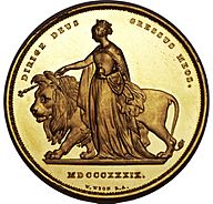 Gold coin showing a woman leading a lion