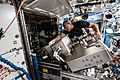Victor Glover works on ISS machinery