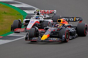 Mick Schumacher of Haas battles for position with Red Bull's Max Verstappen en route to his first points finish in F1 at the 2022 British Grand Prix (52196622846)