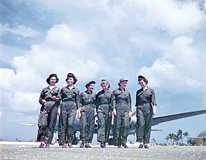 Navy flight nurses walk from their Douglas R5D (C-54)