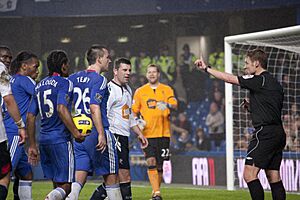 Players confront referee Michael Jones - Chelsea vs Bolton Wanderers