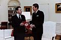 President Reagan receiving the first copy of Soviet Military Power, a Defense Intelligence Agency publication