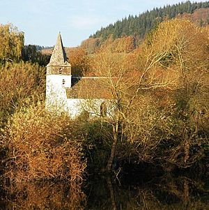 A church with autumn leaves and River Wye