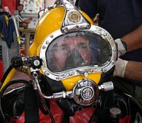US Navy 051026-N-0000X-001 Electronics Technician 1st Class Matthew Ammons, a diver assigned to Mobile Diving and Salvage Unit Two (MDSU-2), is fitted with a Kirby Morgan 37 Dive Helmet