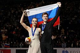 Victoria Sinitsina and Nikita Katsalapov with flag - 2019 World Championships