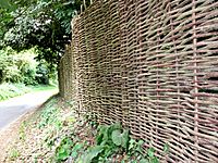 Wickerwork fence and road past Old Hall Farm - geograph.org.uk - 529110