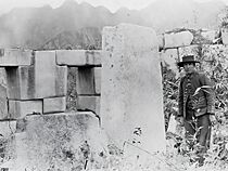 Interior of Machu Picchu's Temple of the Three Windows, with a person standing on the right.