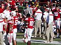Bo Pelini with players during a timeout (Nebraska vs. Rutgers, 2014)