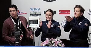 Carreira and Ponomarenko with Scott Moir at the 2022 MK John Wilson Trophy