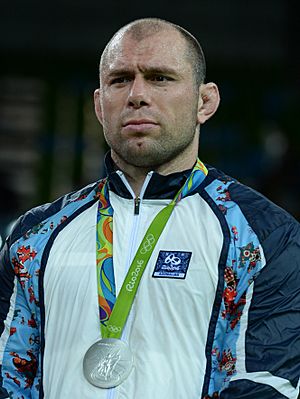 Khetag Gazyumov at the 2016 Summer Olympics awarding ceremony2.jpg